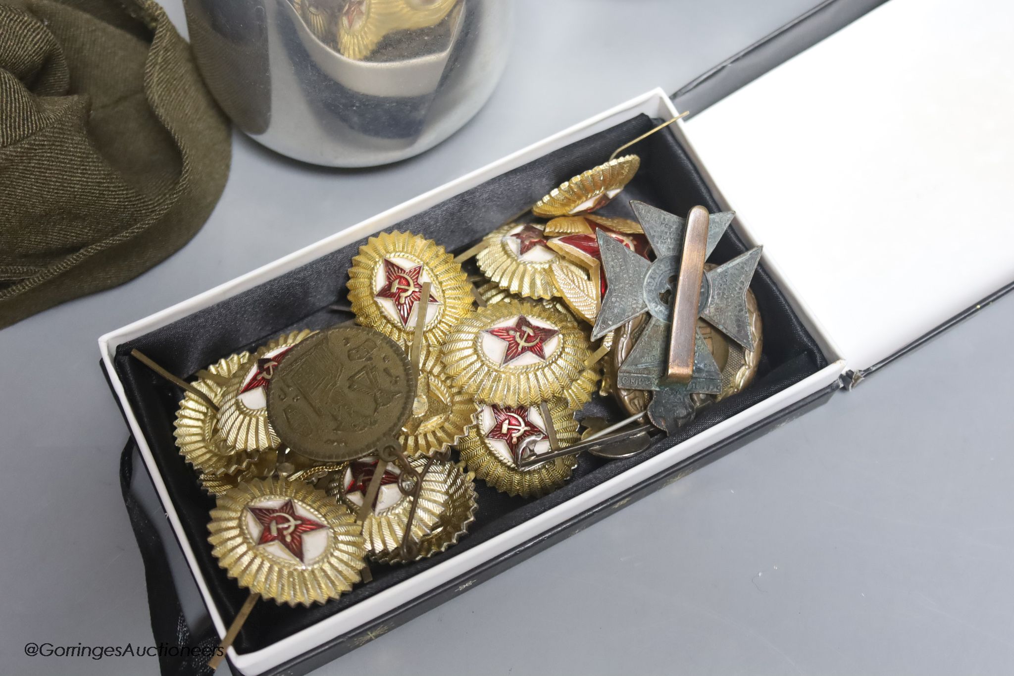 A four-piece Picquot ware tea set together with Russian and German military badges; other medallions etc.